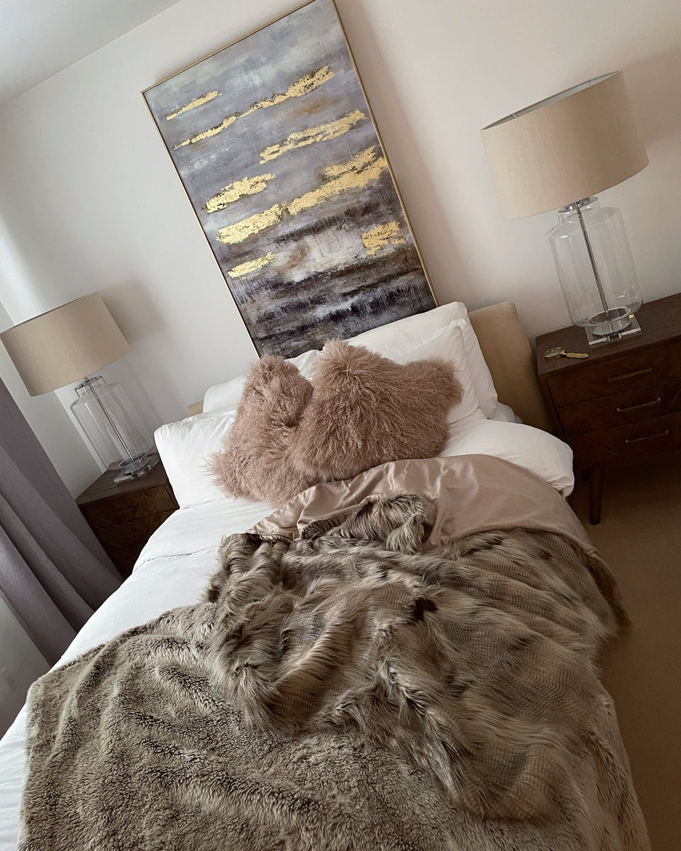 Faux fur throw online on bed